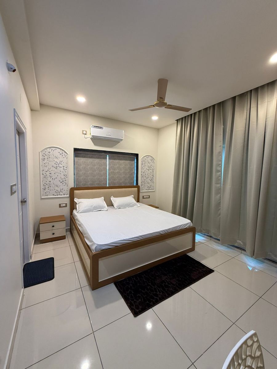 Master bedroom with decorative wall panels and AC