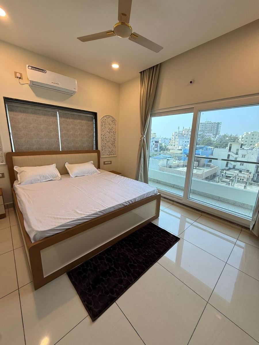 Master bedroom with city view balcony